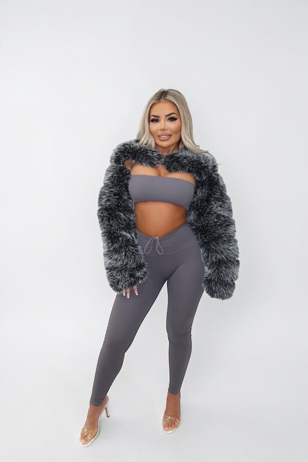 GLAMORZ grey faux fur sleeves worn by a blonde model with a matching grey crop top and leggings set