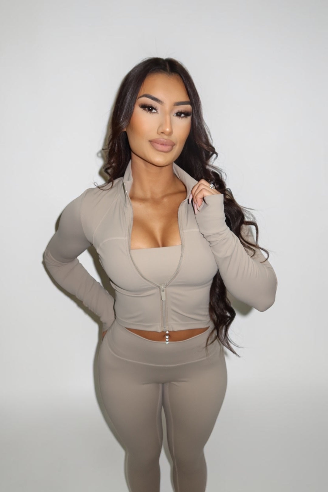 GLAMORZ khaki sculpt jacket with long sleeves and front zipper worn by a woman against a plain background