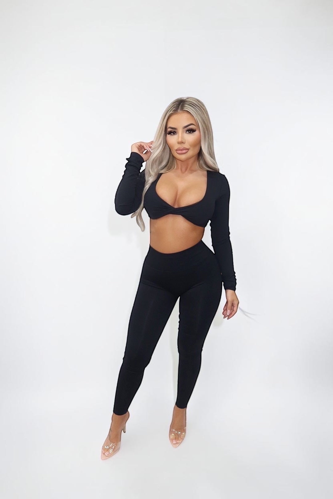 GLAMORZ black ribbed long sleeve crop top with twist detail and matching high-waisted leggings.