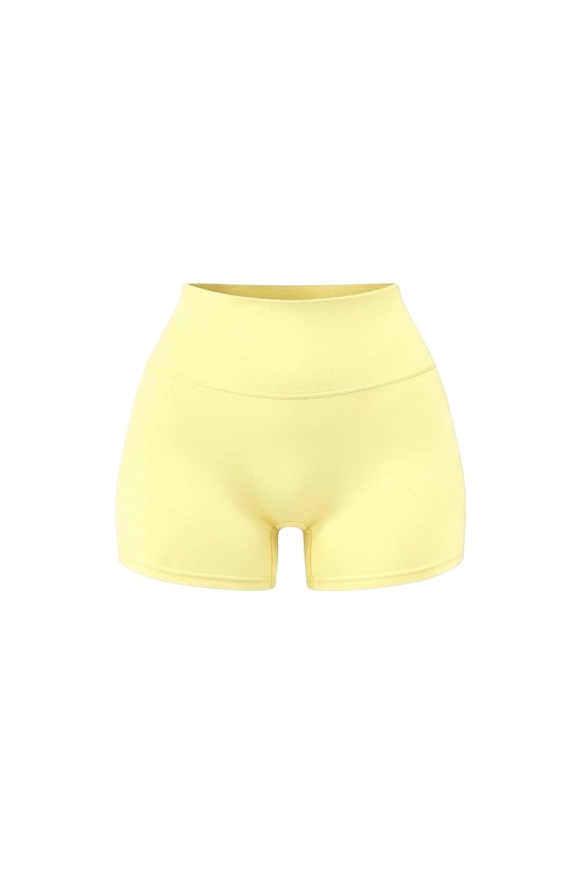 GLAMORZ yellow smooth sculpt shorts with a high-waisted fit and seamless design.